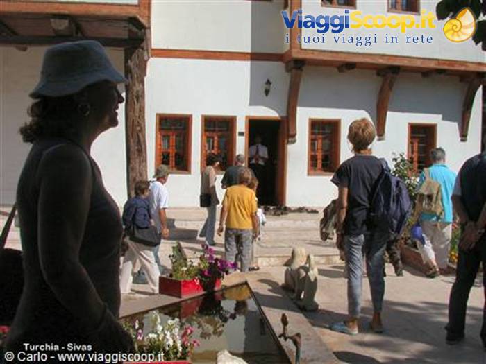 Tourists in front of an Ottoman timber and white house in Sivas