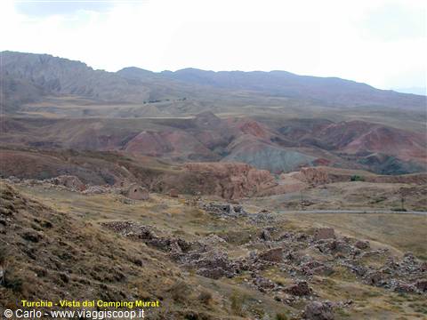 Dry hills and scattered stones near Camping Murat