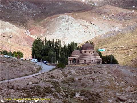 Brick mosque with domes, Ishak Pasha Palace, among arid hills and trees