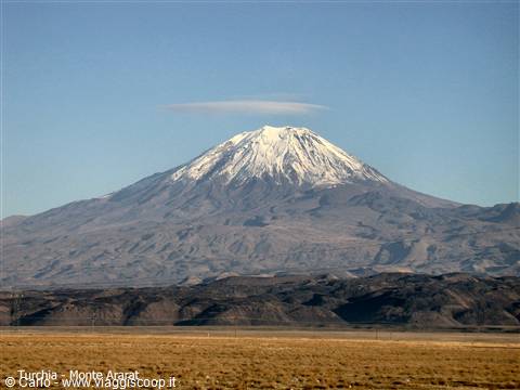 Snow-capped Mount Ararat with lenticular cloud over summit, arid plain below