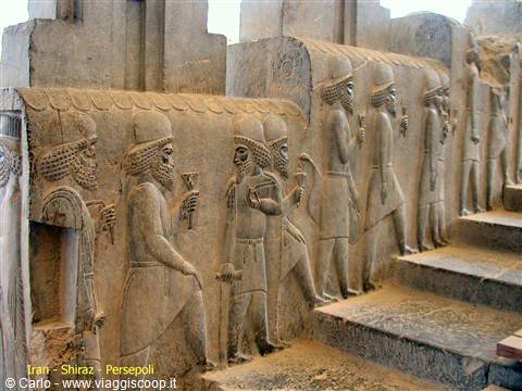 Stone reliefs of Persian dignitaries on the stairs of Persepolis