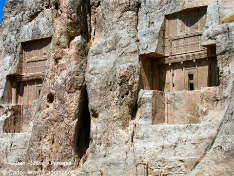 Achaemenid rock-cut tombs carved into cliffs at Naqsh-e Rostam, sunlight