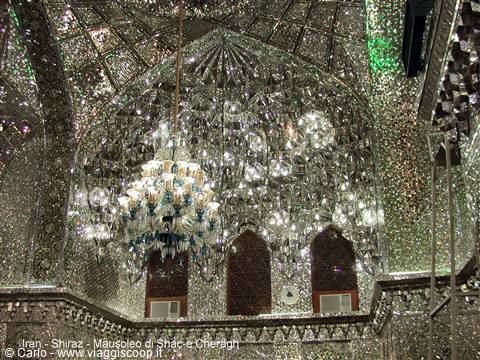 Mirror-decorated interior of Shah-e Cheragh mausoleum in Shiraz, with chandeliers