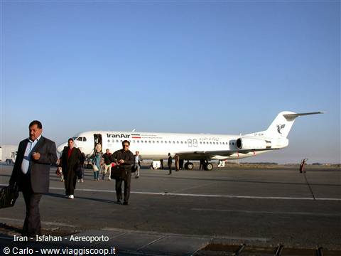 Passengers disembark from an Iran Air plane on the tarmac of Isfahan airport