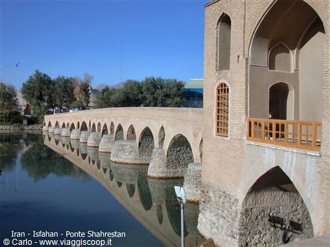Shahrestan Bridge in Isfahan, brick arches reflected in Zayandeh river