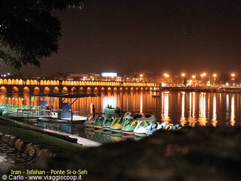 Si-o-Seh Bridge lit up at night over the Zayandeh river, Isfahan