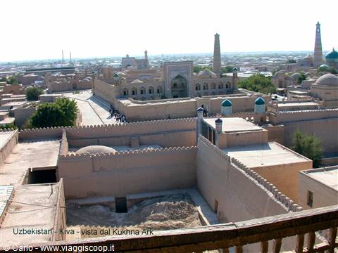 View over Khiva from Kukhna Ark walls, mud brick buildings and minaret