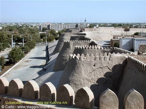 Crenellated mud-brick walls of Khiva seen from the Kukhna Ark