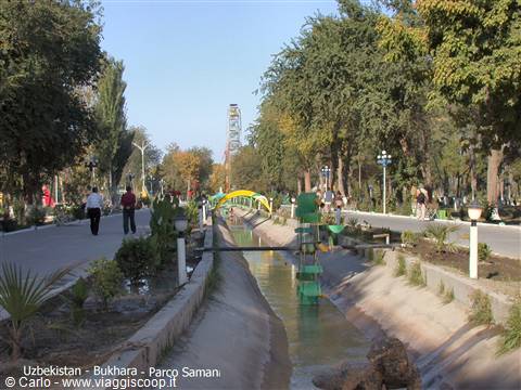Green water wheel along a canal in Samarkand park, Bukhara