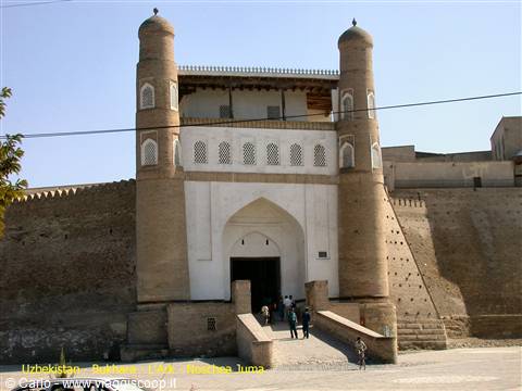 Kuhna Ark fortress gate in Khiva, earthen bricks, bright midday light