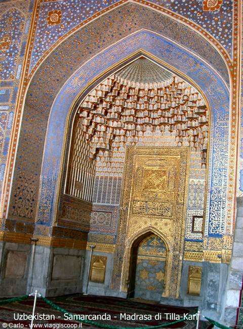Golden mihrab of Tilla-Kari Madrasa in Samarkand, adorned with blue and gold mosaics