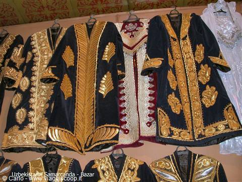Gold-embroidered robes hanging at Samarkand bazaar