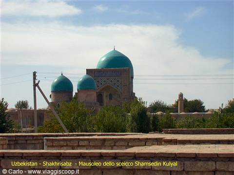 Sheikh Shamsedin Kulyal mausoleum in Shakhrisabz, turquoise domes among trees