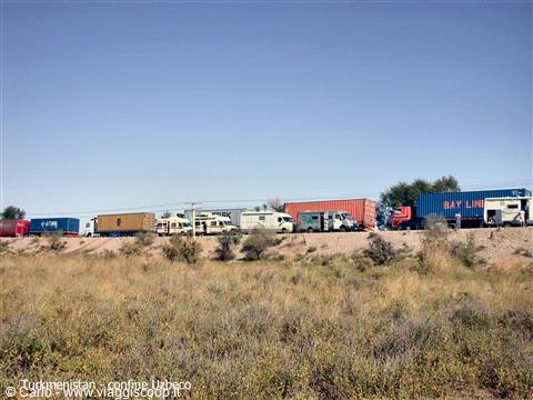 Trucks and containers lined up at the Turkmenistan-Uzbekistan border crossing