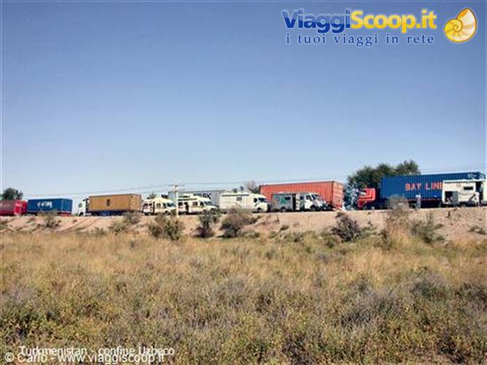 Trucks and containers lined up at the Turkmenistan-Uzbekistan border crossing