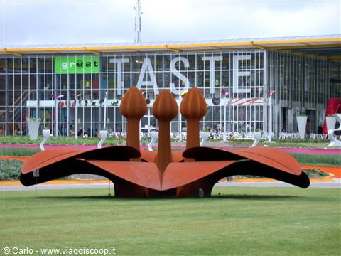 Corten steel flower sculpture in front of the TASTE pavilion at Floriade