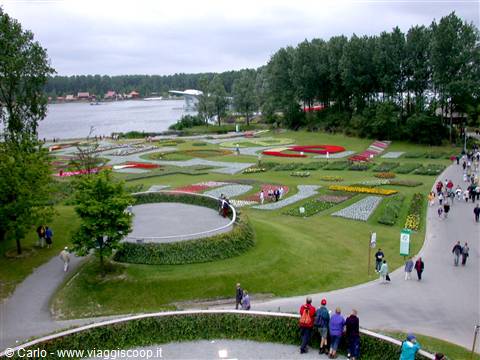 colorful geometric flowerbeds and visitors in Kaisaniemi park, Helsinki