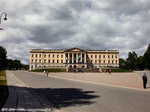 Royal Palace in Oslo with equestrian statue, visitors in the square