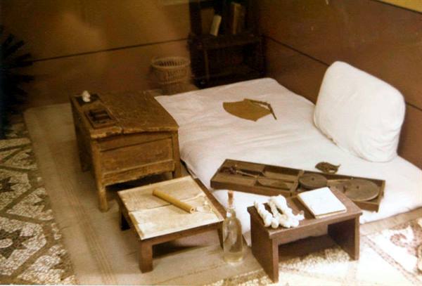 Gandhi's room in Delhi: low bed, wooden writing desks, spinning tools
