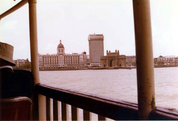 Gateway of India and Taj Mahal Palace seen from a ferry in Mumbai harbor