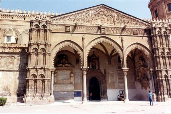 Gothic portal of Palermo Cathedral, carved stone arches under sunlight