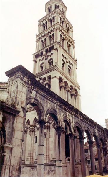 Romanesque bell tower above stone arches of Diocletian's Palace in Split