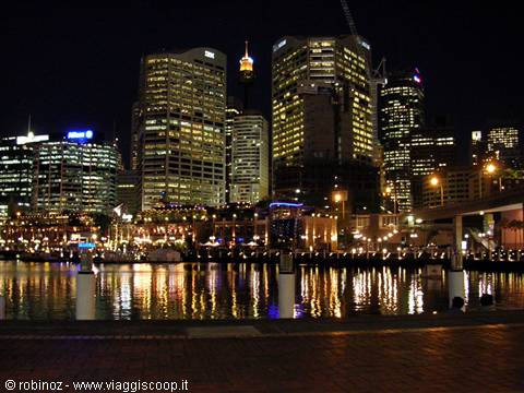 Darling Harbour at night: illuminated skyscrapers reflected in the bay water