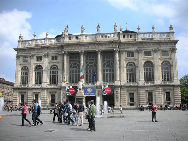 Palazzo Madama in Piazza Castello, Turin, fountains and people strolling by