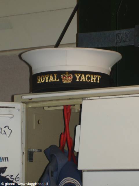 White sailor cap with Royal Yacht inscription, resting on a metal locker