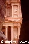 The Treasury facade carved in pink rock at Petra seen from the Siq