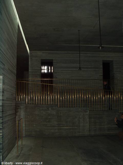 Vals thermal baths: grey stone pools and brass railings under soft light