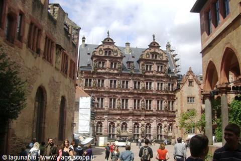 Tourists in Heidelberg Castle courtyard with the Renaissance sandstone facade