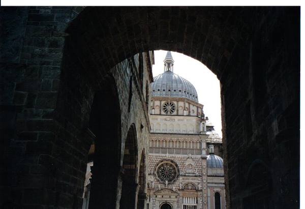Bergamo's Colleoni Chapel framed by a dark stone arch