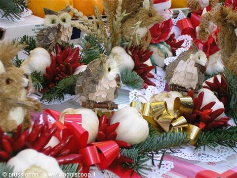 Christmas market stall: handmade owls, garlic, red chilies and ribbons