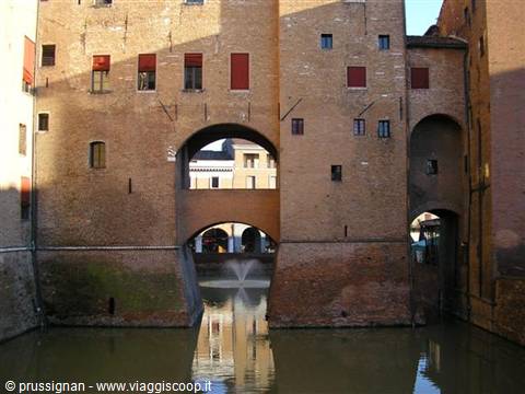 Castello Estense in Ferrara, brick walls and moat with fountain