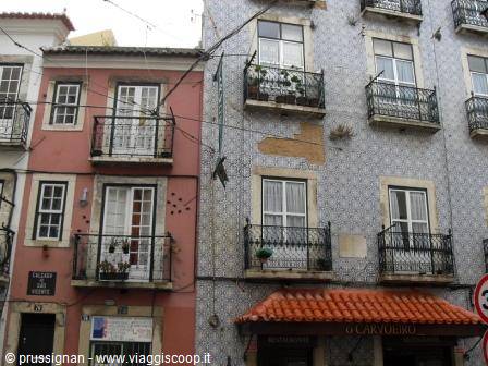 Tiled facades with wrought-iron balconies in Lisbon, soft light