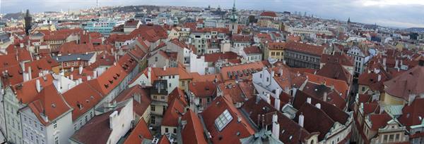 Prague red rooftops seen from above under a cloudy sky