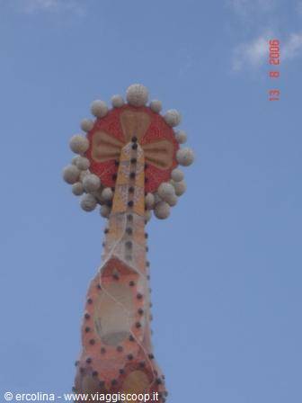 Gaudí's spire topped with green cross and sphere crown, Sagrada Familia