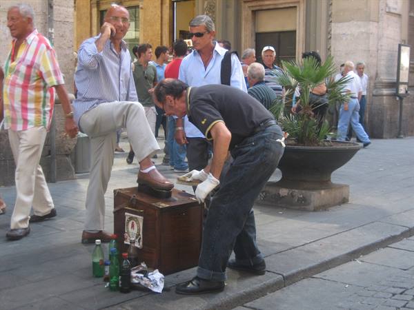 Shoeshiner at work