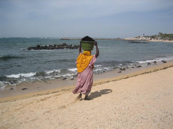 Woman with a basket of fish