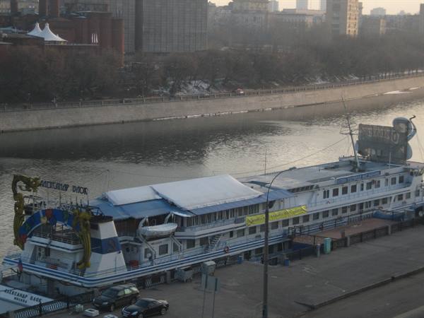 Restaurant boat moored along the Moskva River in winter light