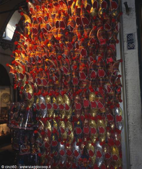 Traditional Turkish slippers hanging at a stall in Istanbul's Grand Bazaar