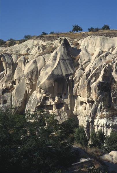 Tuff cliff with cave dwellings, Göreme, Cappadocia, sunlight