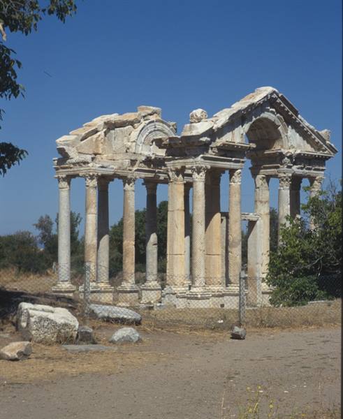 Tetrapylon of Aphrodisias, marble columns and arches under blue sky