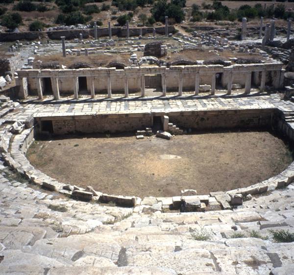 Ancient theatre of Aphrodisias, marble seating and columned stage in bright light