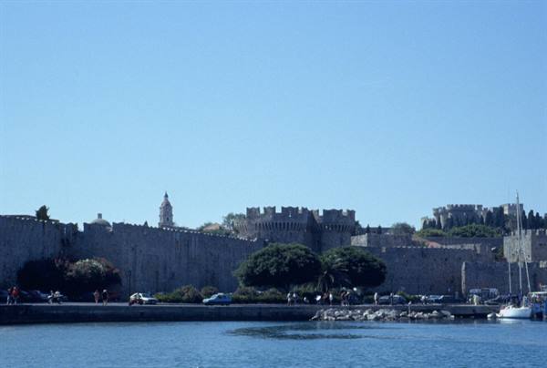 Medieval fortress walls of Rhodes town by the harbour