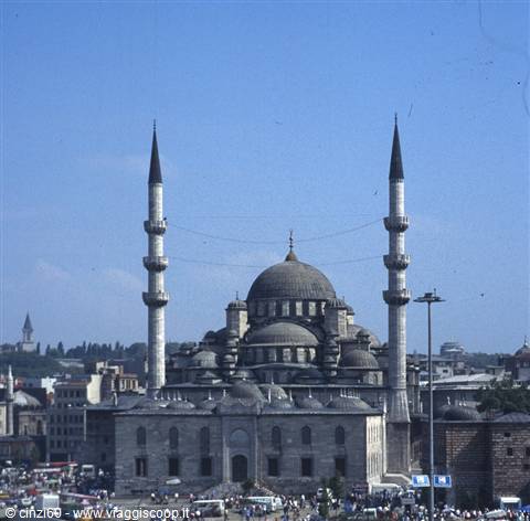 The New Mosque in Istanbul with domes and minarets under a blue sky