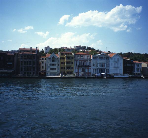 Colorful wooden houses overlooking the Bosphorus, blue sky with clouds