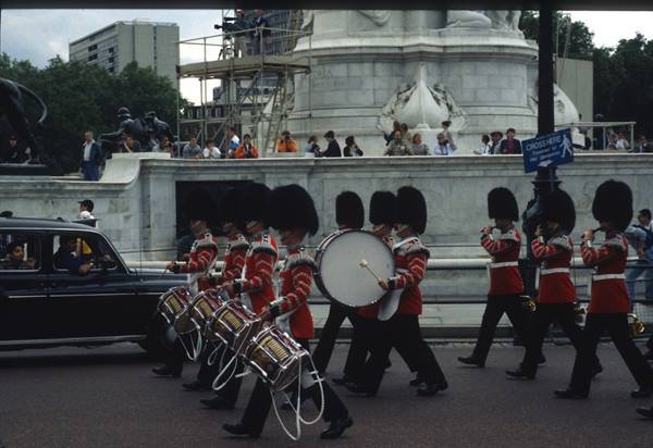 Drum corps of the Queen's Guards marching past the Victoria Memorial, London
