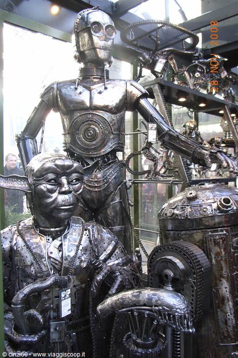 Recycled metal sculptures of C-3PO, Yoda and R2-D2 displayed in a shop window